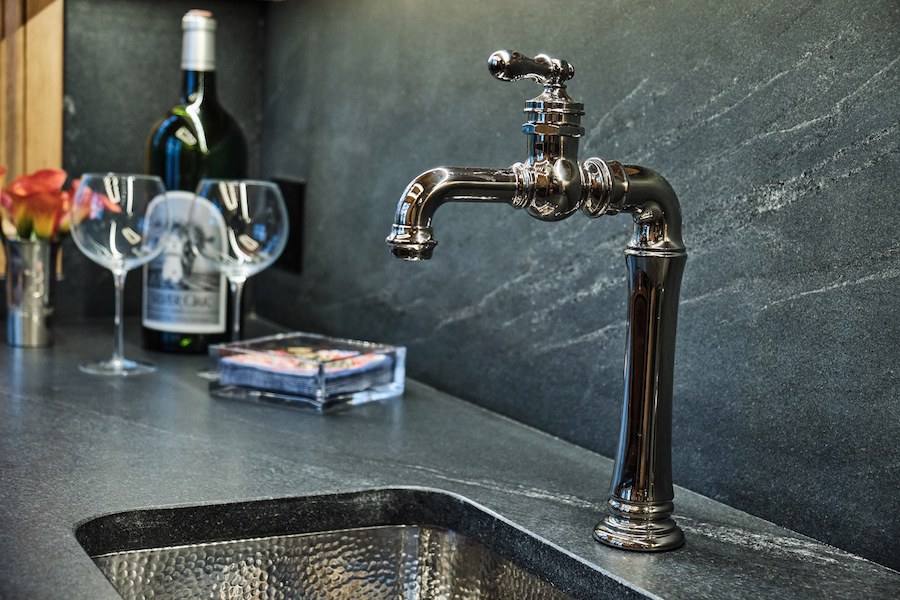 buckhead bar granite and soapstone emulated countertops with hammered metal sink