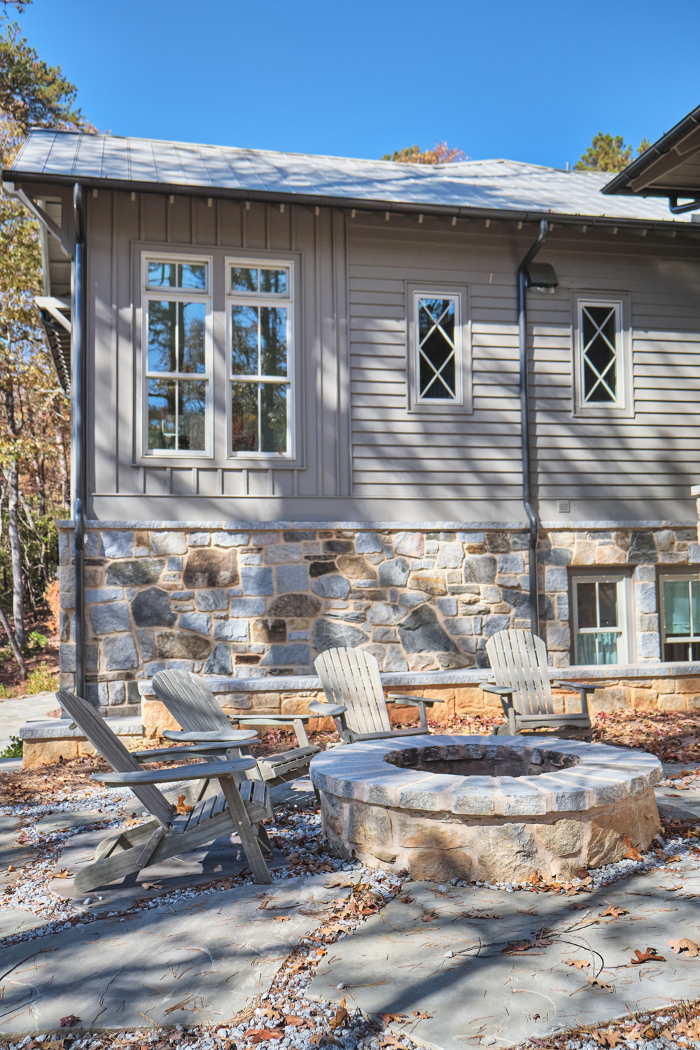 unique stone and crisscrossed window panes on the exterior of the house