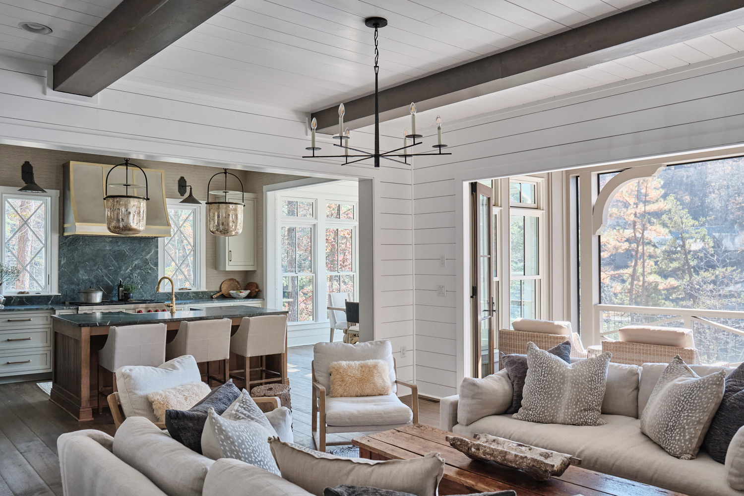 a wide view of the main floor with the living room opening up into the kitchen and dining area
