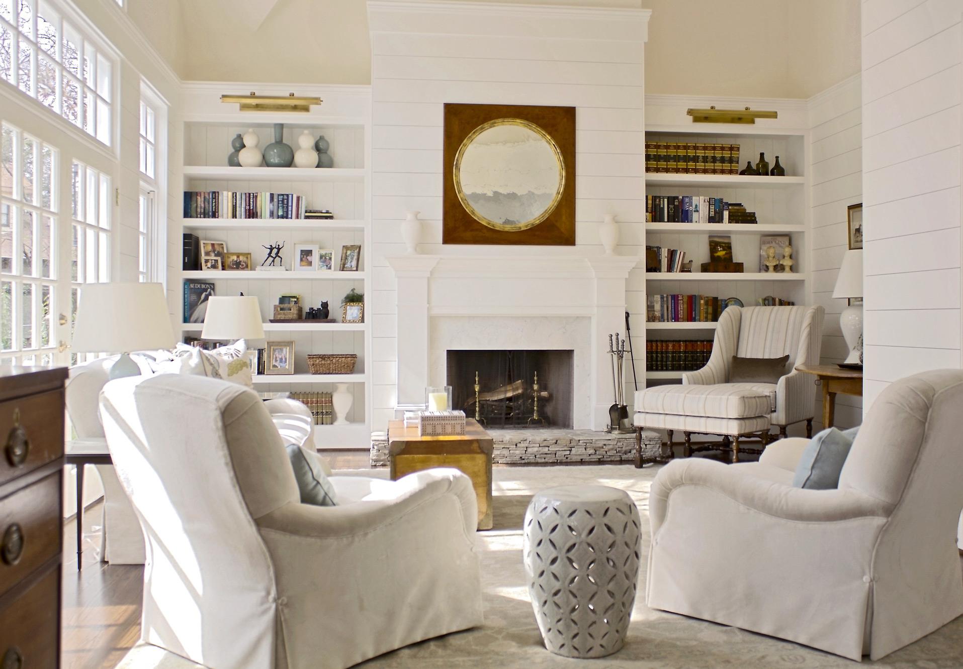 collier classic living room with built in bookcases and shiplap siding