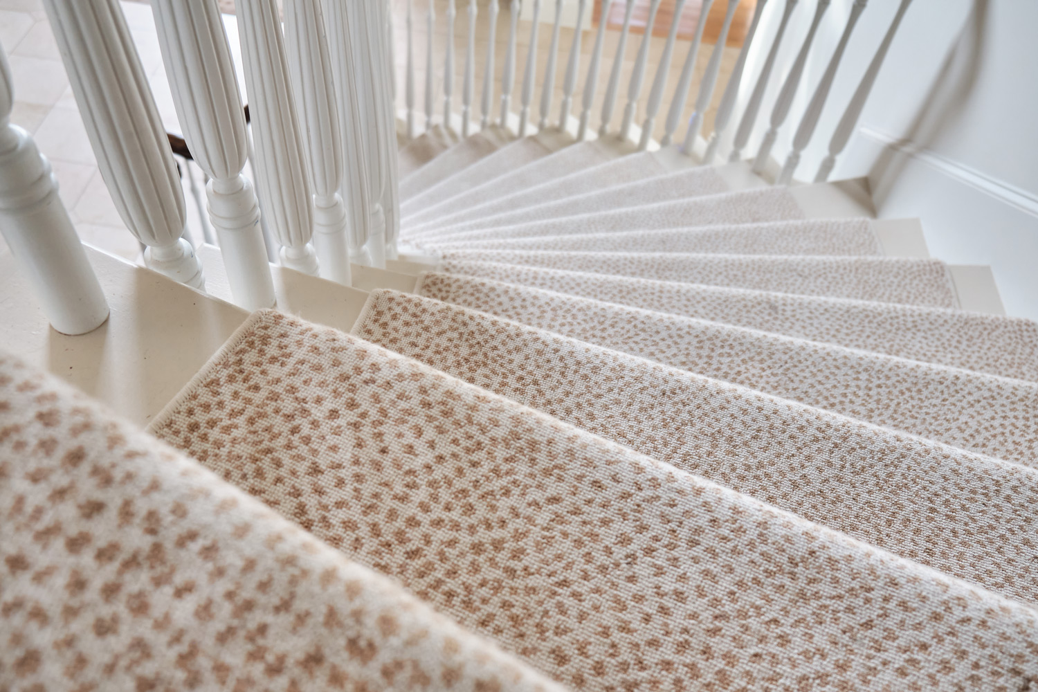 detail of the white and brown cheetah print carpet lining the stairs