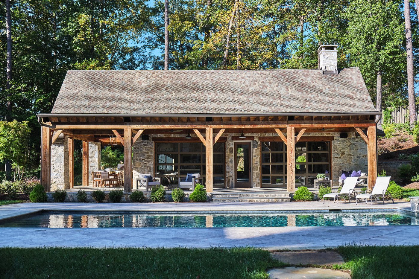 full view of pool house from across the pool